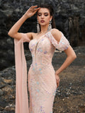 Romantic blush pink mermaid evening gown featuring hand-beaded 3D floral embroidery, a unique one-shoulder neckline, and a flowing detachable sheer cape for weddings or galas.