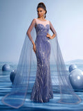 Elegant navy blue sequin mermaid evening gown featuring an illusion round neckline and dramatic sheer flowing cape sleeves for formal galas or weddings.