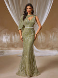 Olive green crystal mermaid evening gown featuring a draped one-shoulder cape, intricate crystal embroidery, and a beaded waistband for formal galas or weddings